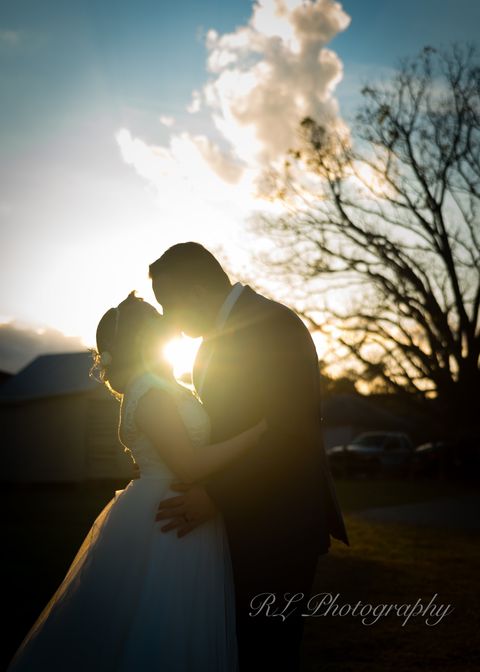 Golden Sun Shine Kiss Between the Bride and Groom - RL Photography