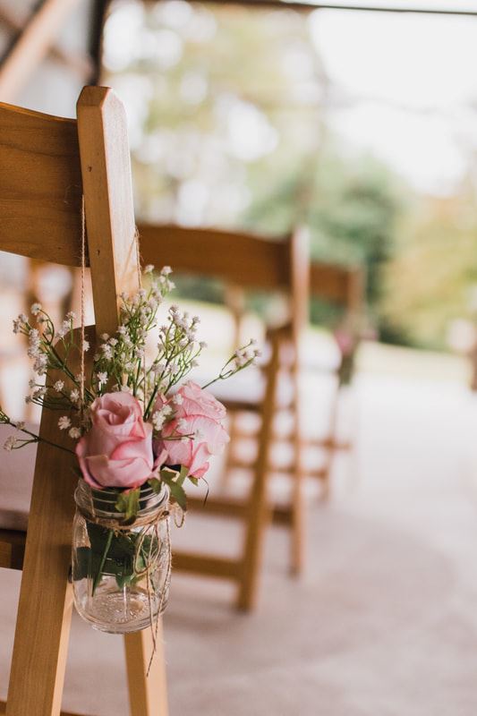 Rebecca Stevenson Photography of Wedding Chair with Flowers